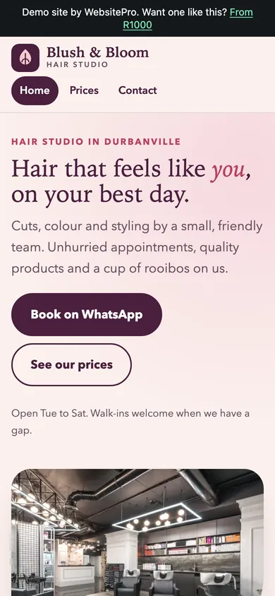 Phone screenshot of the Blush and Bloom Hair Studio example website, with a soft pink hero and a Book on WhatsApp button